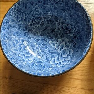 Vintage Japanese porcelain bowl with a blue Sometsuke flower design.